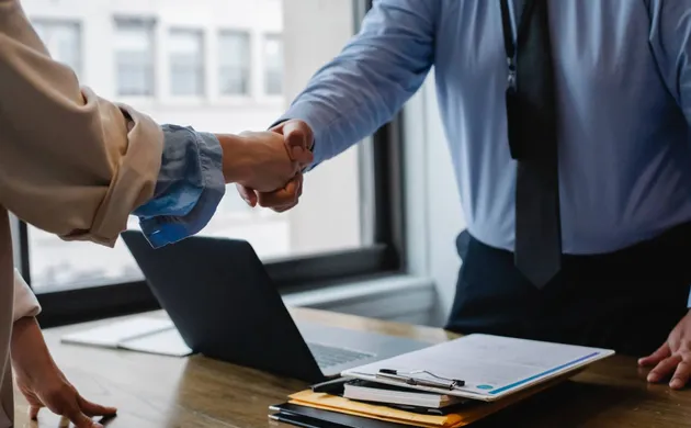 two individuals discussing business